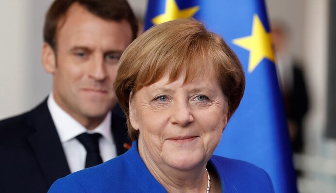 Танок з ведмедем: чому Меркель і Макрон поспішають пообідати з Путіним